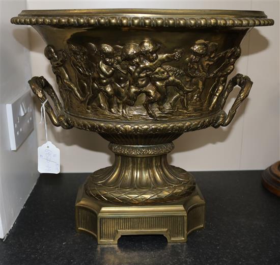 A large gilt bronze two handled oval vase, moulded with continuous bacchanalian scene, height 14.75in.